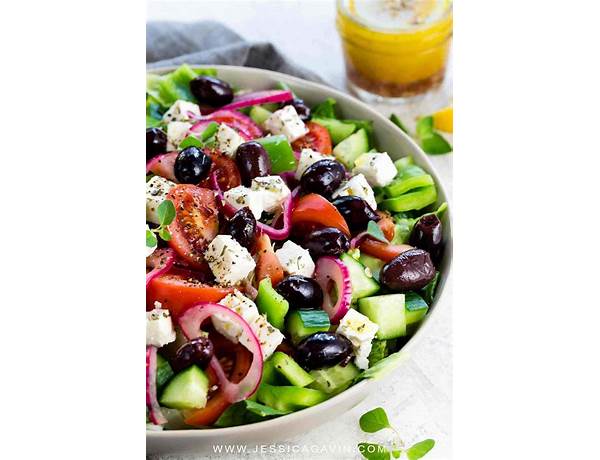 Greek style salad with herb and oil dressing ingredients